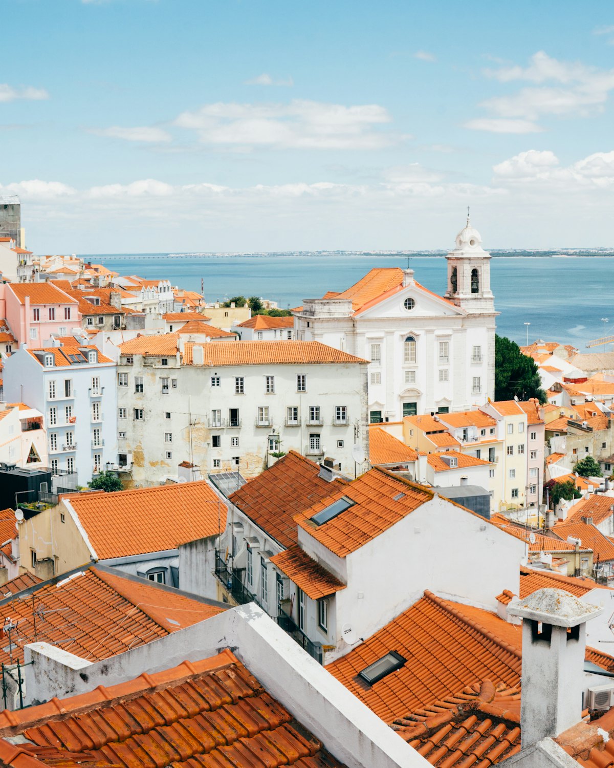 Orange-roofed houses beside the water in the Algarve, Portugal