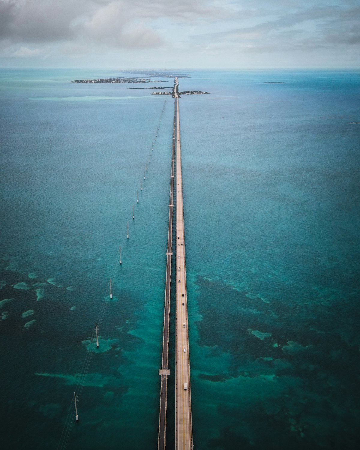 A wooden dock over turquoise water in the Florida Keys