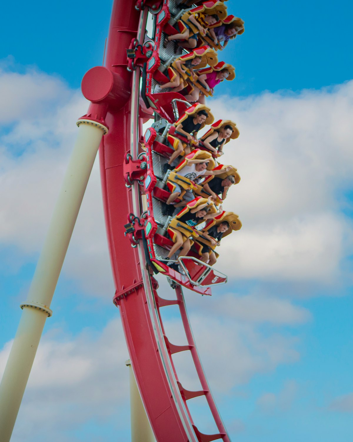 People riding a rollercoaster at a theme park
