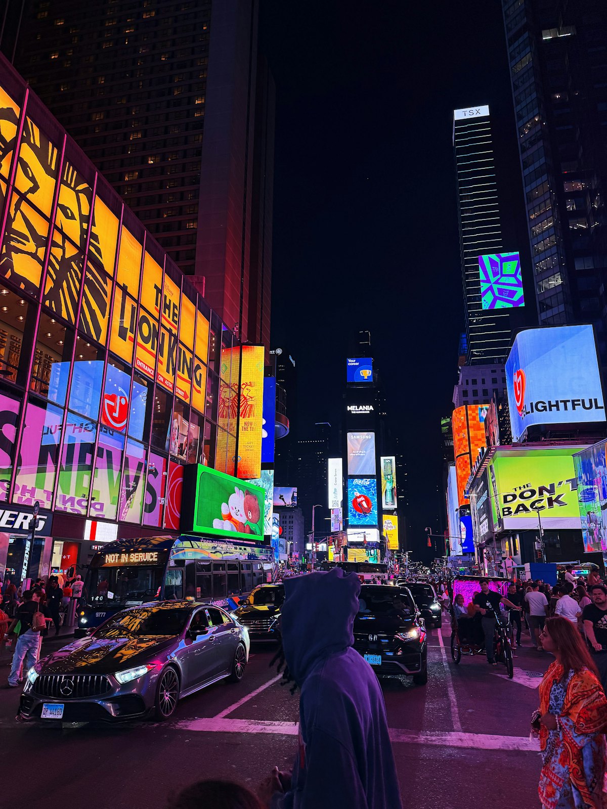Times Square at night with bright billboards