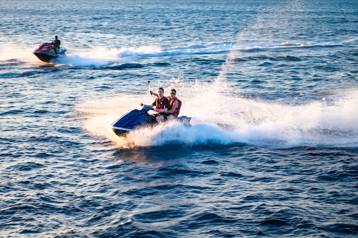 Two riders on a jet ski at sea