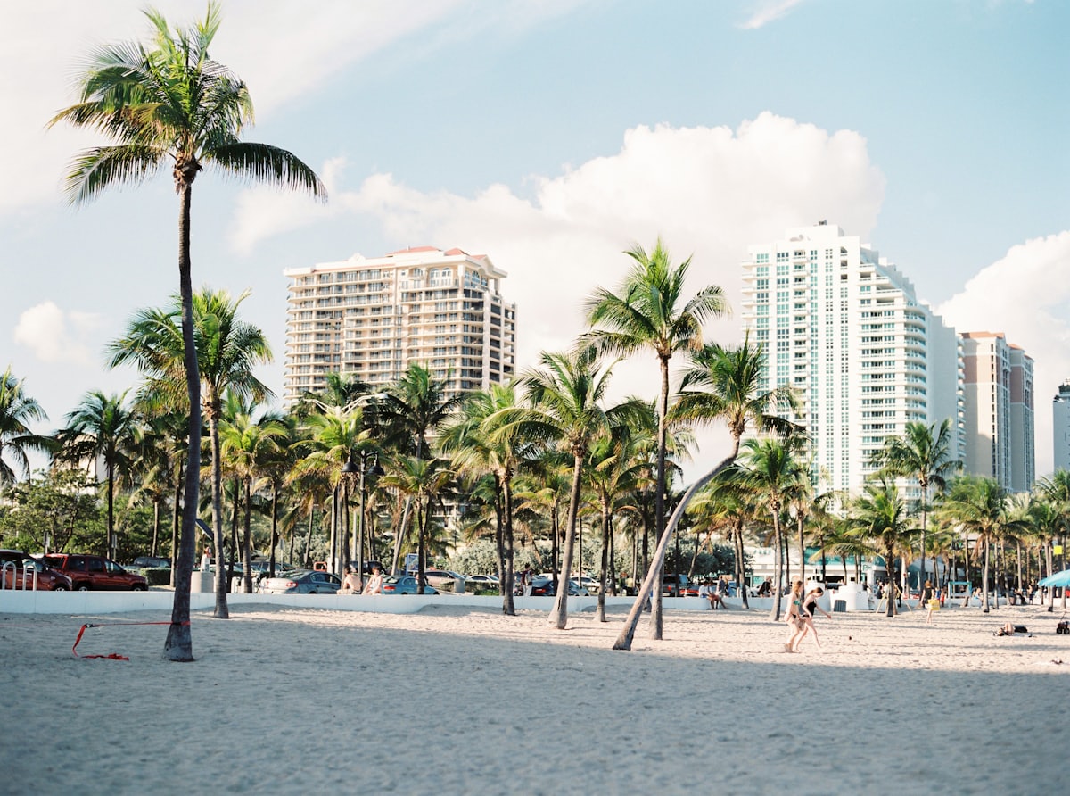 Palm trees in front of pastel Miami Beach buildings