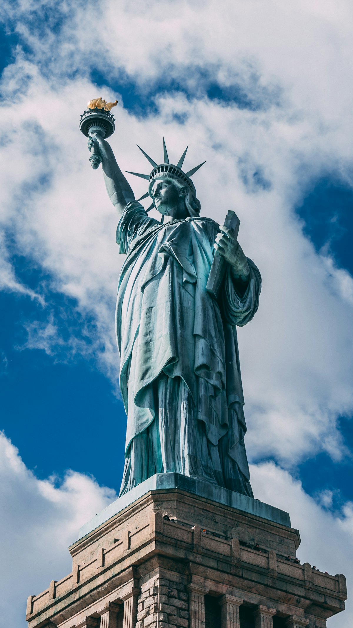 The Statue of Liberty under a clear blue sky