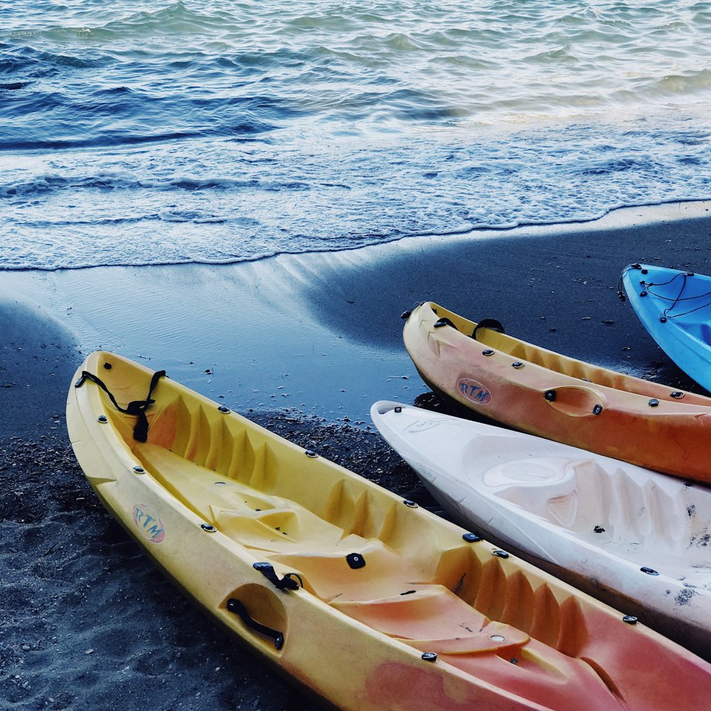 Kayaks lined up on the shore