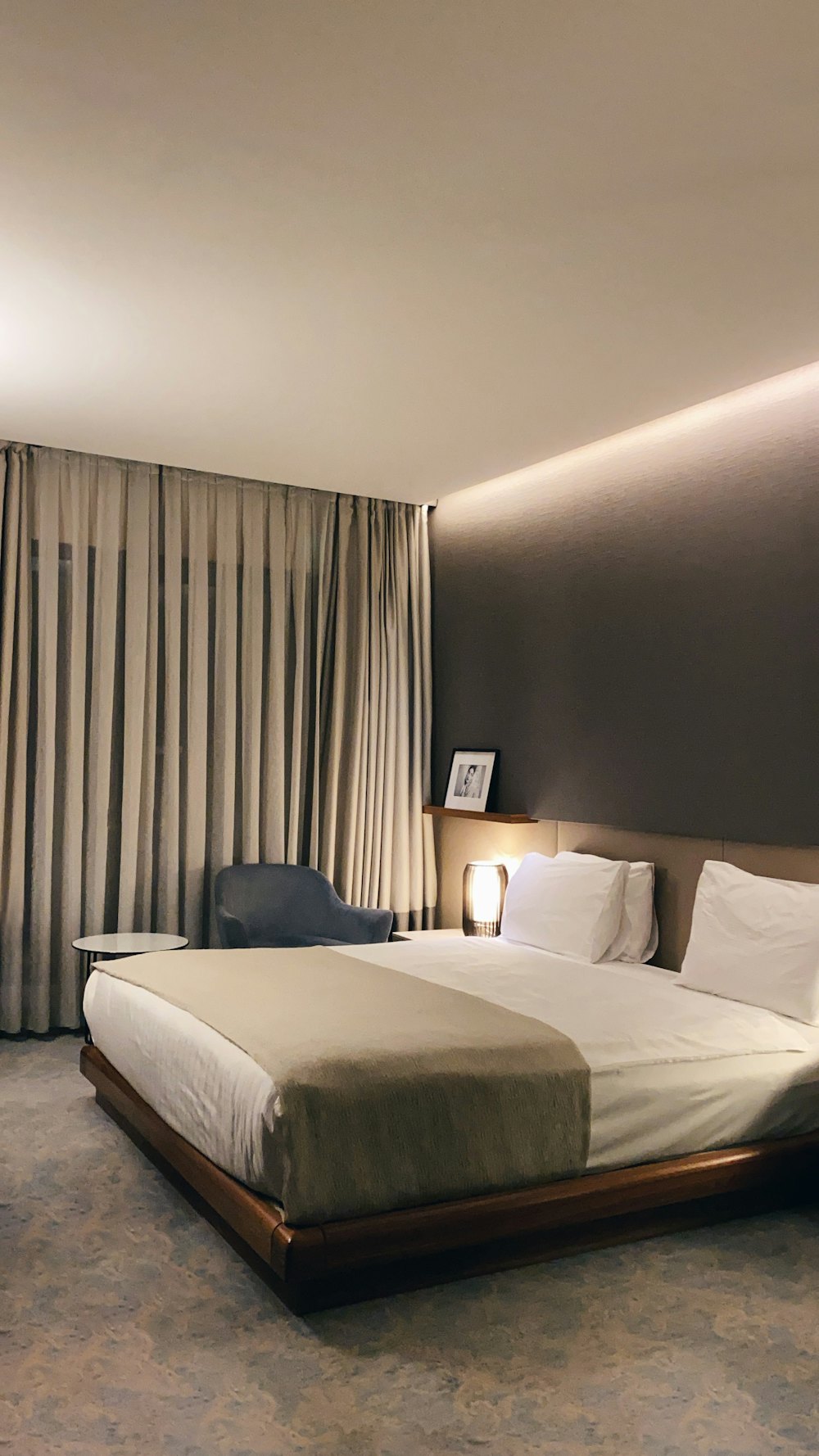 A made hotel bed with cushions